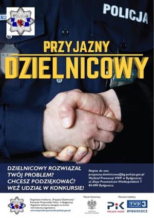 Zdjęcie przedstawia w przybliżeniu uścisk dłoni dwóch umundurowanych policjantów. stanowi to tło zdjęcia. W lewym rogu zdjęcia znajduje się gwiazda kujawsko - pomorskiej Policji poniżej napis koloru żółtego Przyjazny Dzielnicowy, a jeszcze poniżej napisy dotyczące organizowanego konkursu.